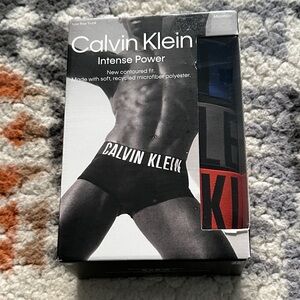 Calvin Klein 3 Pack Microfiber low rise trunks. Black trunk w/ blue/orange/gray.